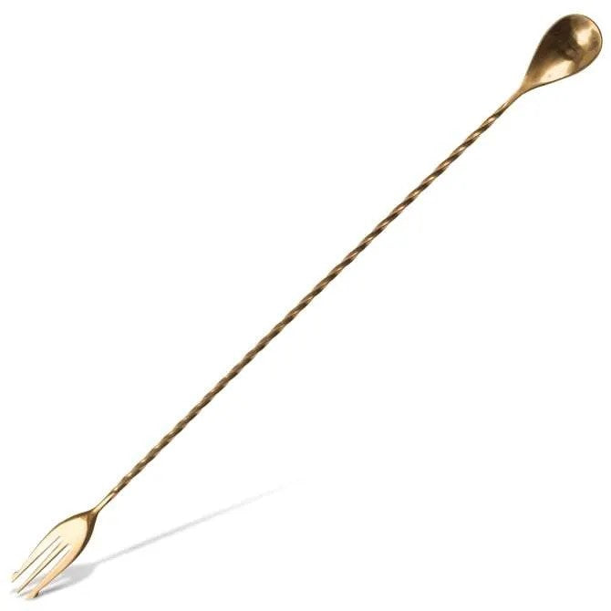 1241 A long gold bar spoon with a twisted handle, ending in a fork. It appears to be made of stainless steel with a shiny finish.