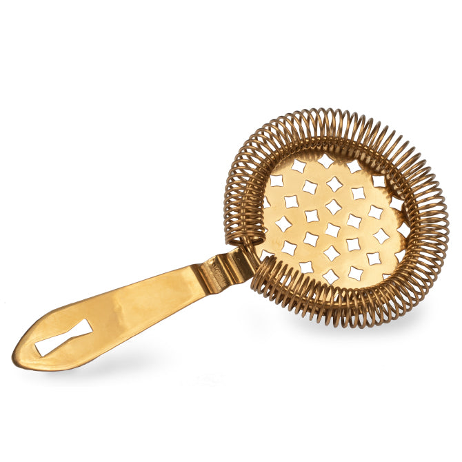 A gold Barfly Antique spring bar strainer with a perforated circular body and an S-shaped handle on white background.