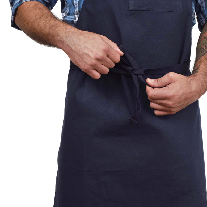 Navy Blue Bib Apron shown close up being tied on white silo background.