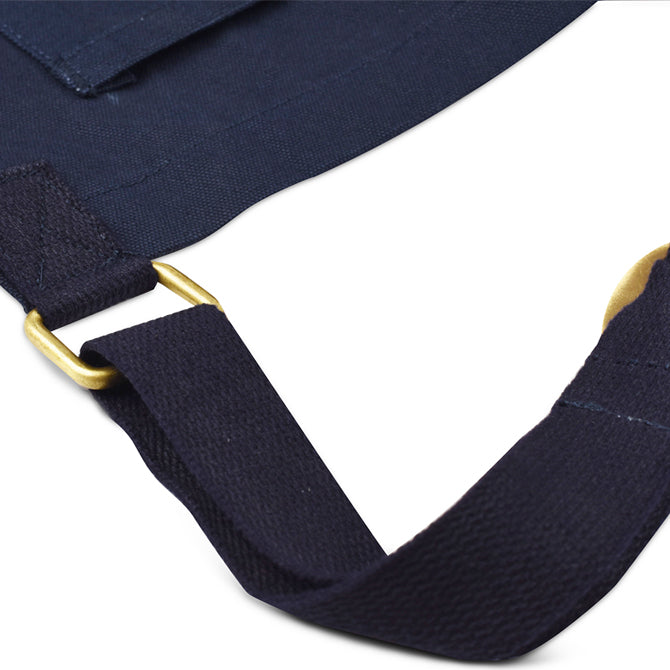 Bib Apron from JB Prince showing gold straps on white silo background.