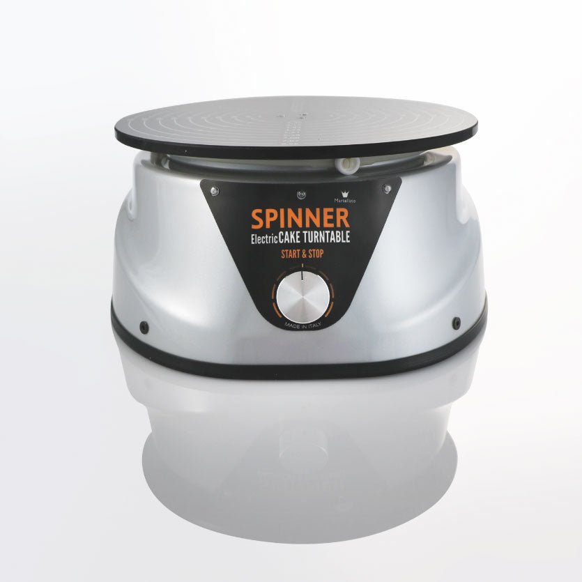 Black and silver cake electric cake spinner on a white background. 