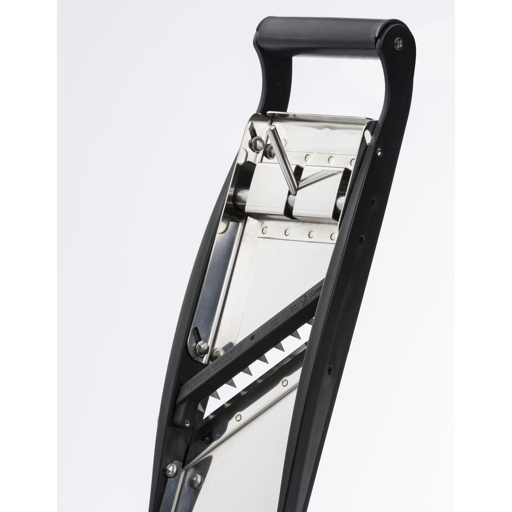 Rear Metallic part of mandolin with a black handle on a white background