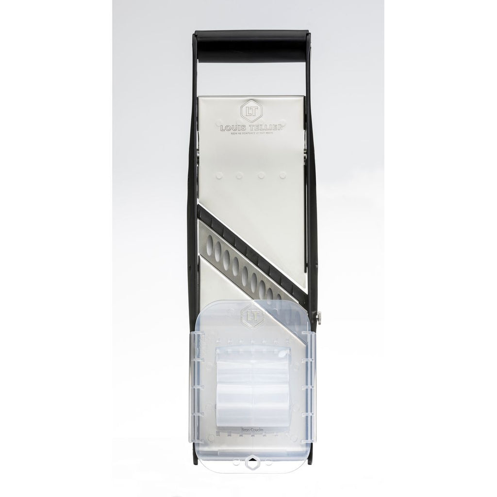 Tall rectangular metal Mandolin Blade with a clear plastic safety component on a white background