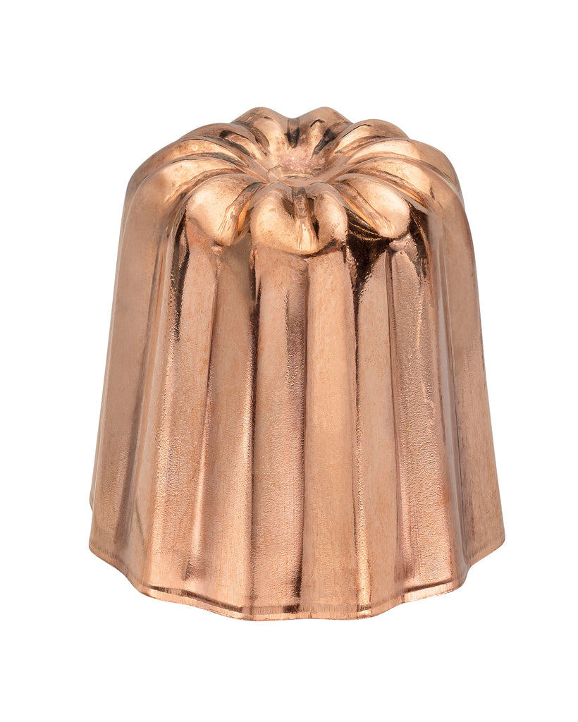 Copper colored metal cake mold on a white background.