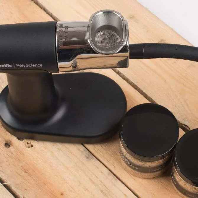 Smoking Gun Pro from above with wood chips on wood table.