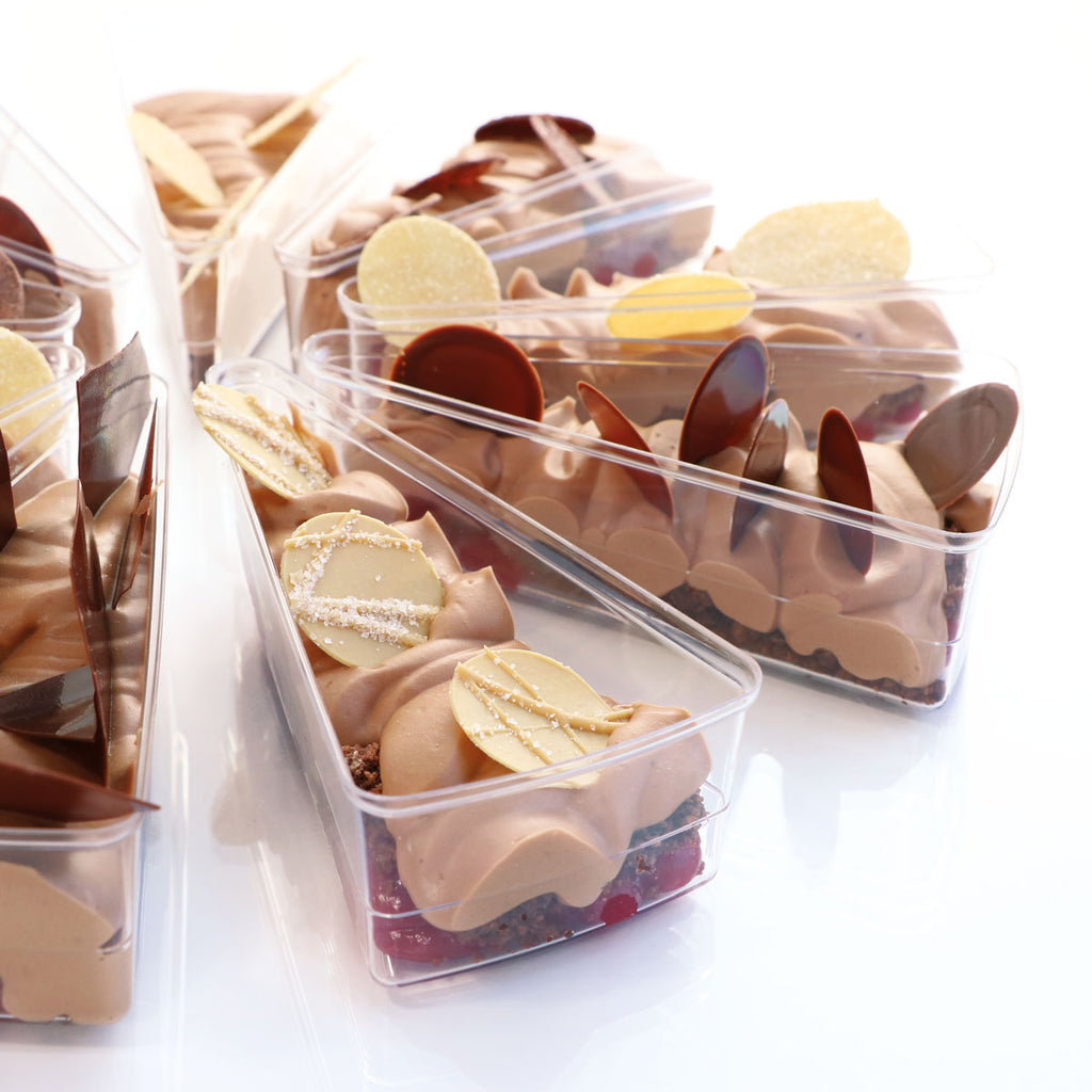 Several Slice Vessels set up as a cut pie, filled with confections , set on white silo background.
