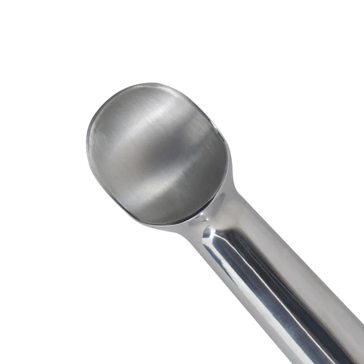 Metallic ice cream scoop on a white background.
