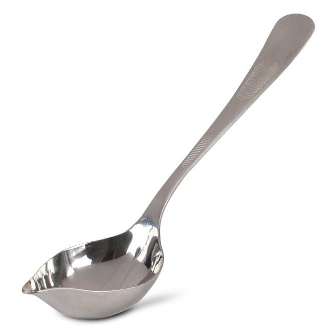 Upright Silver Drizzle Spoon on white Silo Background.