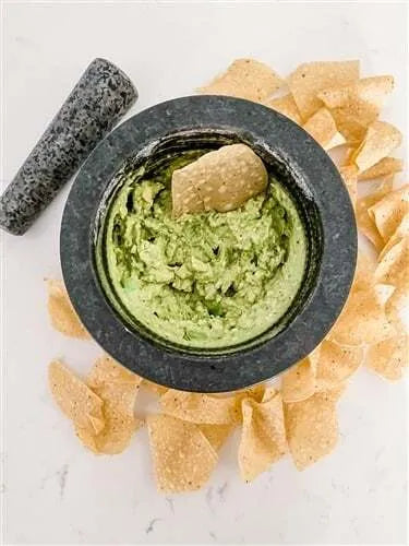 UA276 Mortar and Pestle showing guac and chips in bowl from above.