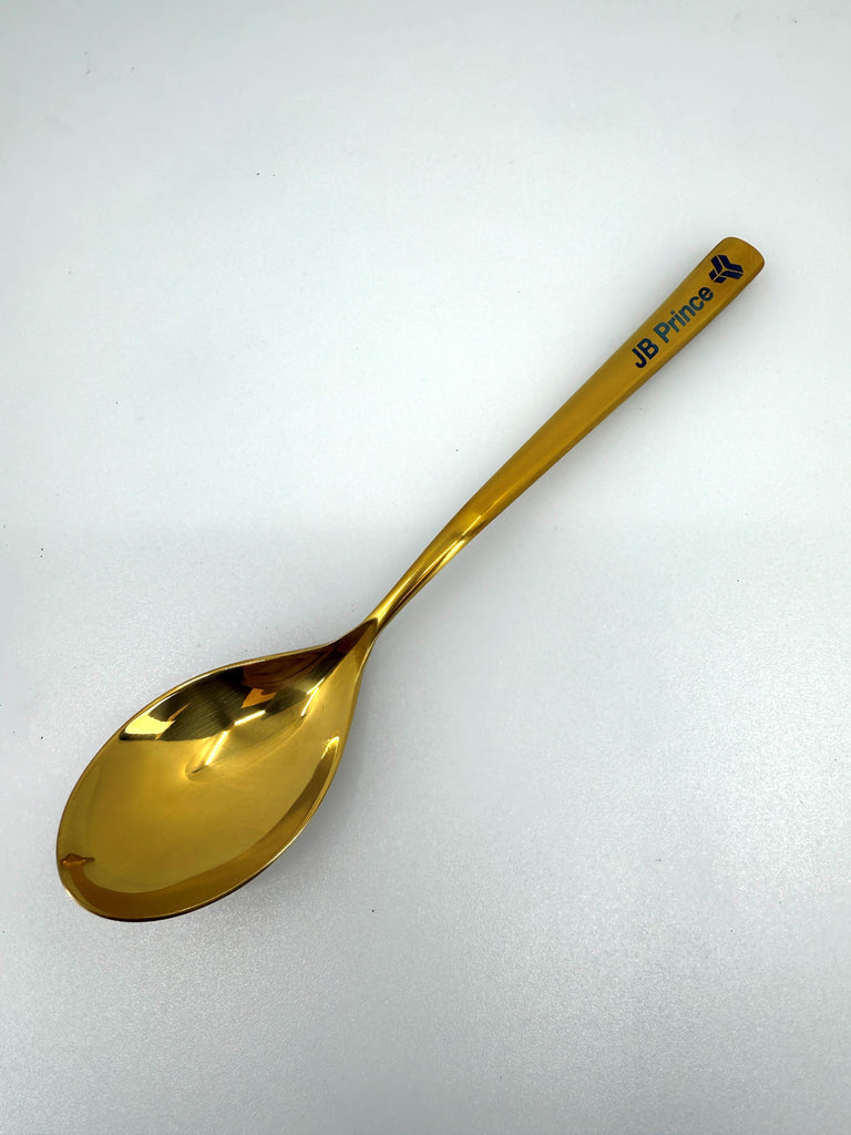 Titanium Gold Spoon showing Rocher Spoon on white silo background.