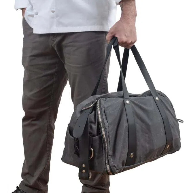 Barfly Bartender Utility Bag being heled on white background.