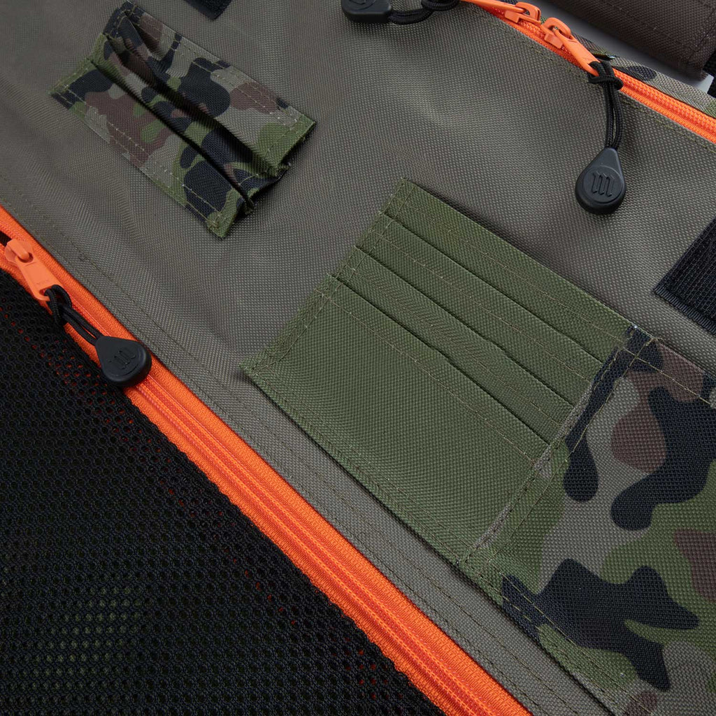 Camouflage knife roll interior showing pockets with camouflage, black and orange trim.