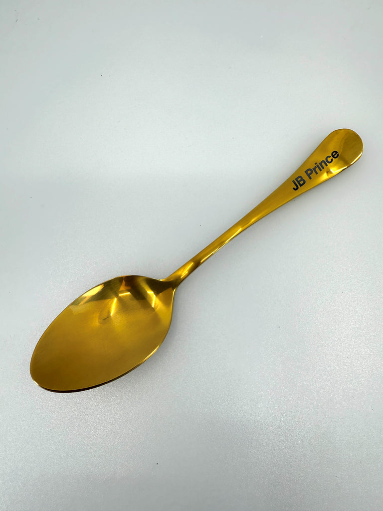 Titanium Gold Spoon showing Plating spoon on white silo background.