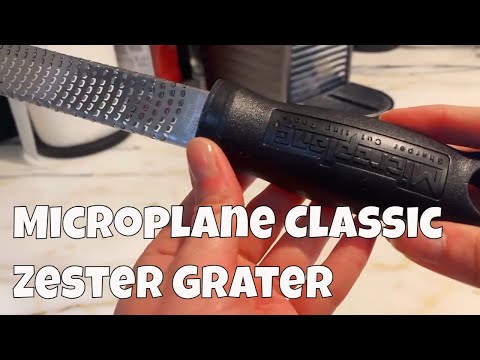 U746 Microplane Classic Zester Grater in Black being show in in detail zesting within video clip.