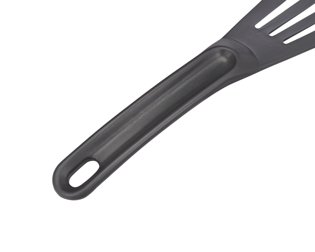 Grey slotted spatula  handle with hole on a white background